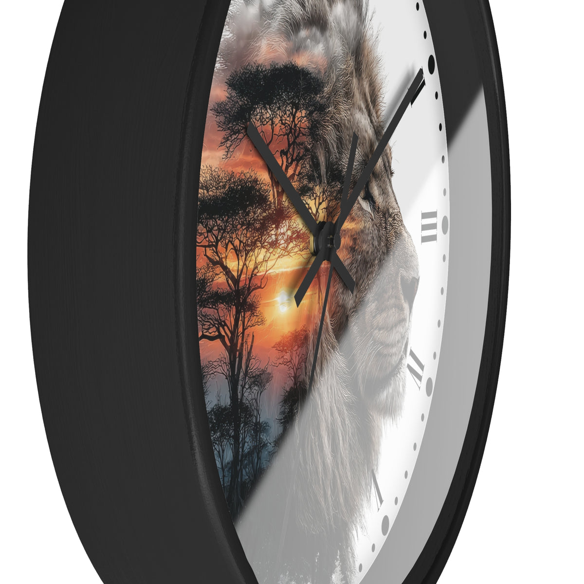 A close-up of a round wall clock with a black frame and a split-face design: one half shows a lion portrait, the other half shows an African savanna sunset with trees, on a white clock face with Roman numerals.