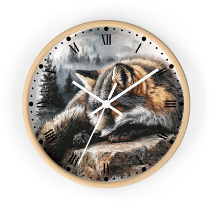 Round wall clock with a light wood frame and a printed wolf resting on a rock in a misty forest scene. The clock face has black Roman numerals and white hands, shown against a plain white background.