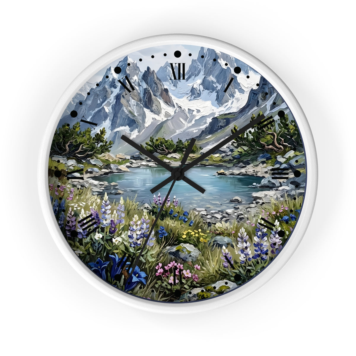 A round wall clock with a white frame and a scenic landscape print featuring snow-capped mountains, a lake, and wildflowers. The clock has black Roman numerals and black hands.