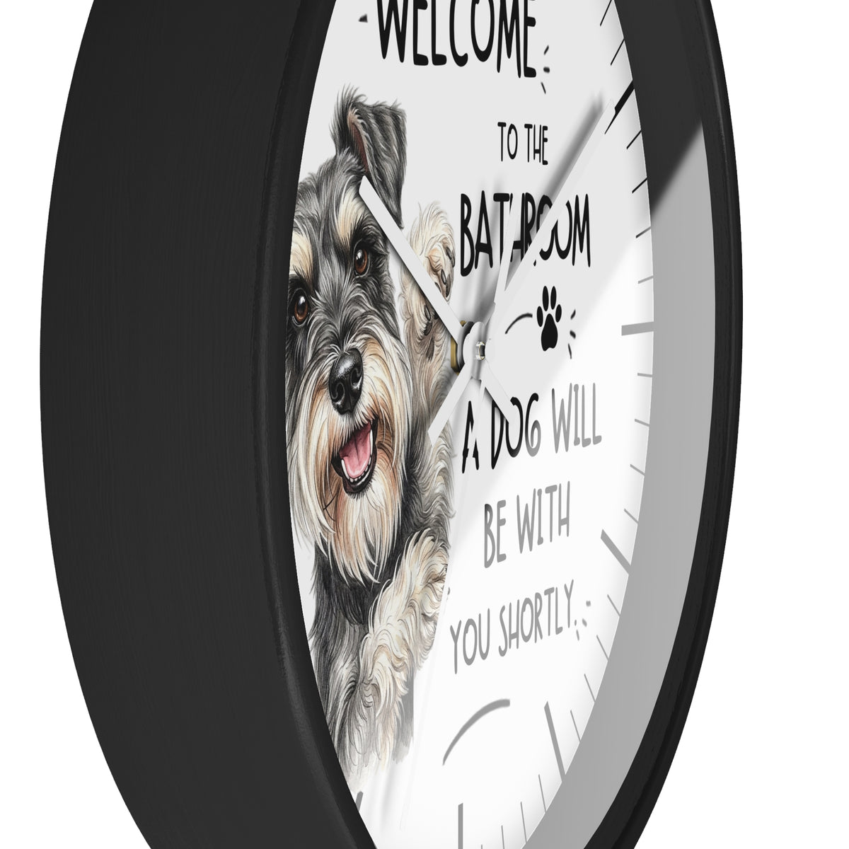 A round wall clock with a black frame and a white face featuring a detailed illustration of a gray and white dog and the text 'WELCOME TO THE BATROOM A DOG WILL BE WITH YOU SHORTLY'.