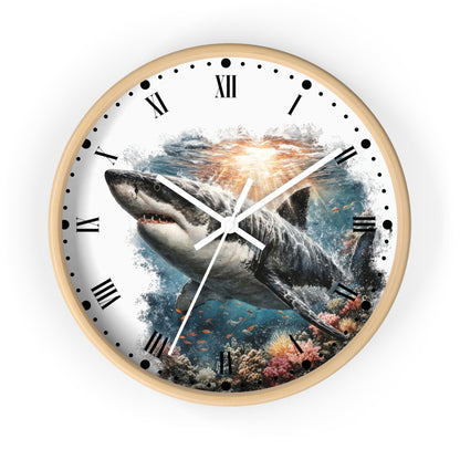 A round wall clock with a light wood frame and a printed shark underwater scene on the face, featuring black Roman numerals and white hands, shown against a plain white background.