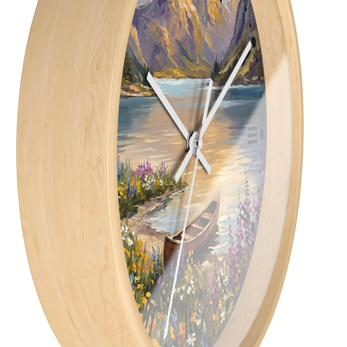 Oval wall clock with a light natural wood frame and a scenic landscape print featuring a lake, mountains, flowers, and a canoe, with white hands on a white background.
