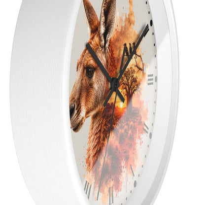 A white round wall clock with a printed face featuring a kangaroo profile and an autumn tree silhouette over a warm orange sunset, shown against a plain white background.