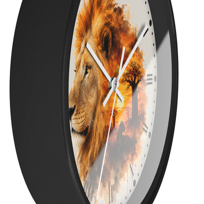 A round wall clock with a black frame and a white dial featuring a lion portrait blended with an orange sunset and tree scene. The clock is shown at an angle against a plain white background.
