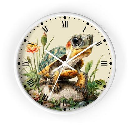 A round wall clock with a white frame and a vintage-style illustration of a turtle on the clock face, surrounded by flowers and greenery, with black Roman numerals and hands.
