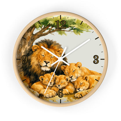 A round wall clock with a light wood frame featuring a watercolor-style illustration of a lion and four lion cubs under a tree. The clock face has a pale gray background with black Arabic numerals and white clock hands.
