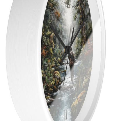 Round wall clock with a white frame and a printed nature scene of a forest stream and waterfall on the face, shown against a plain white background.