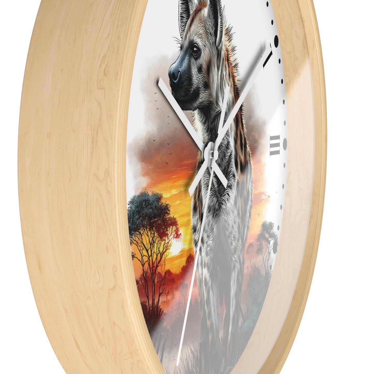 Round wall clock with a light natural wood frame and a printed scenic face showing a hyena over a savanna sunset with trees. The clock is photographed against a plain white background.
