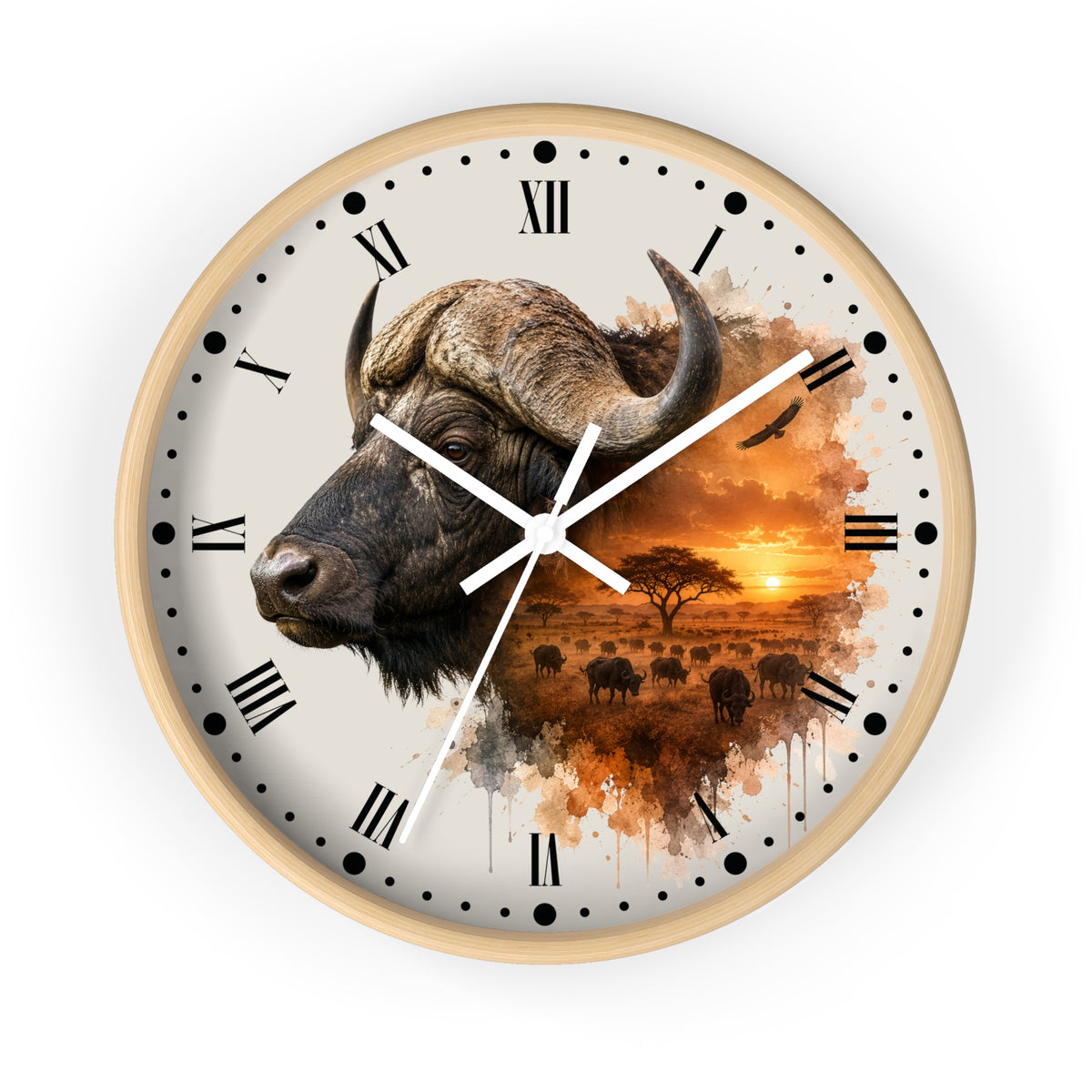 A round wall clock with a light wood frame and a printed safari design. The clock face features a large watercolor-style buffalo head on the left, Roman numerals, black hour markers, white clock hands, and an orange sunset landscape with bison silhouettes on the right.