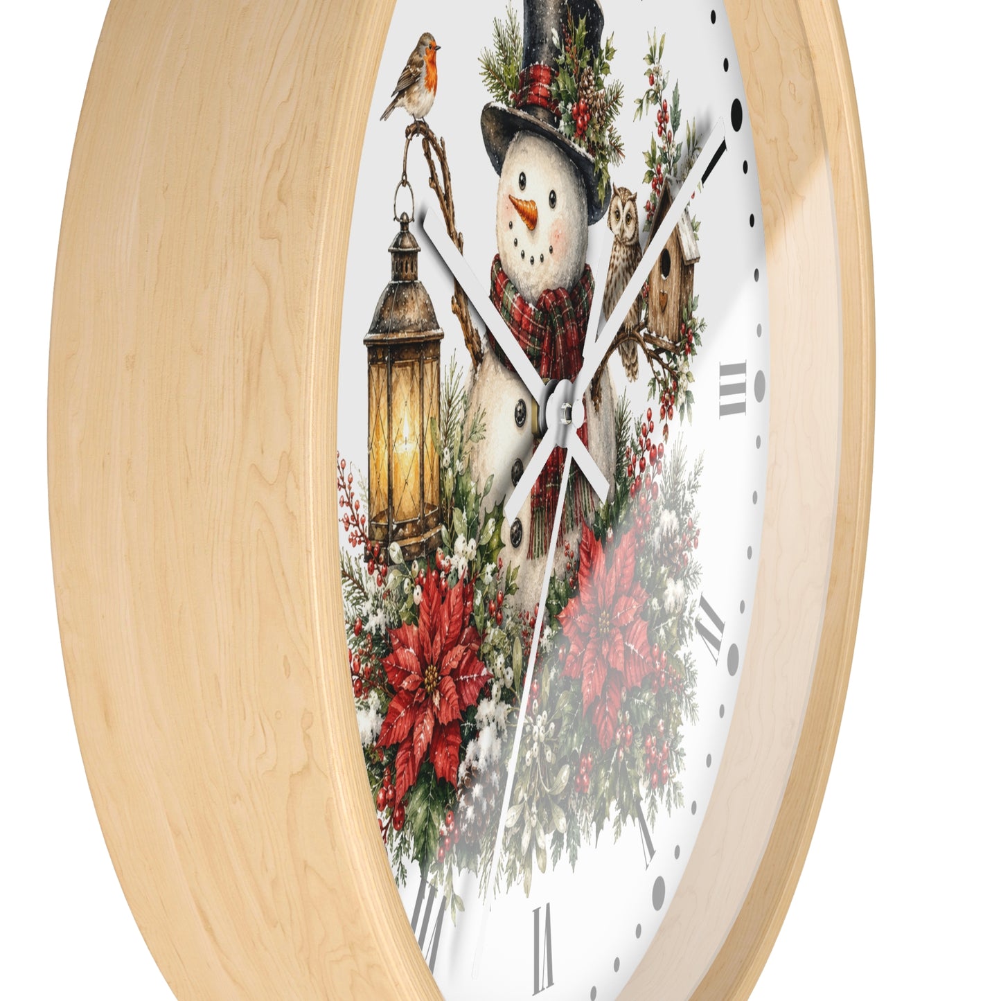A round wall clock with a light natural wood frame and a white face featuring a festive winter scene with a snowman, lantern, bird, owl, and red flowers.