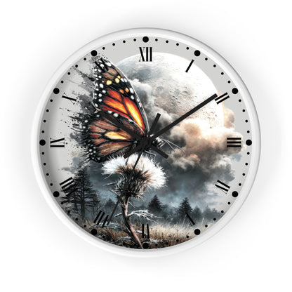 A round wall clock with a white frame and a surreal printed face showing a monarch butterfly over a dandelion, a full moon, clouds, and trees. The clock has black Roman numerals and black hands.