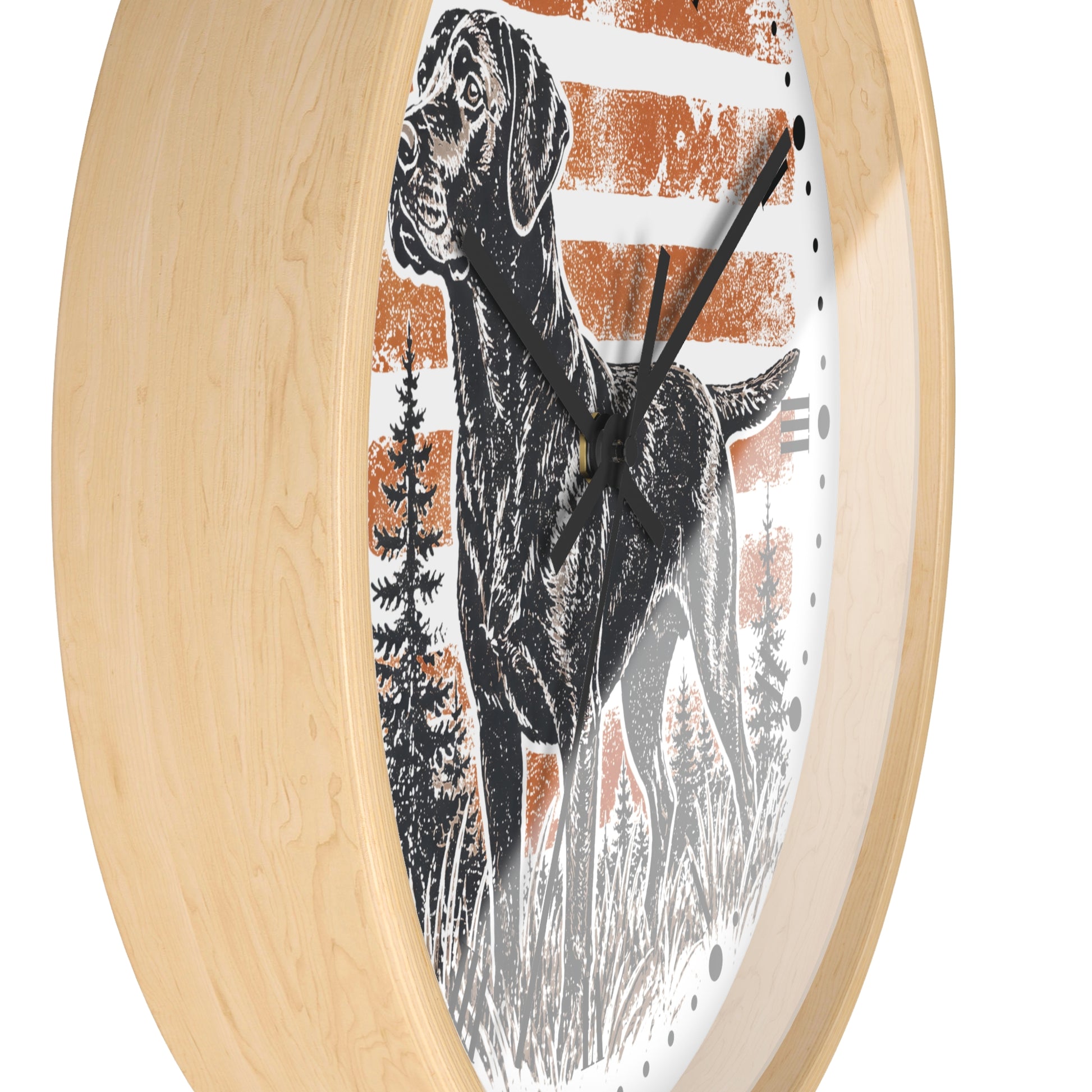 Round wall clock with a light natural wood frame and a printed dog illustration on the face, set against a plain white background.