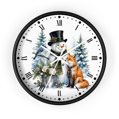 A round wall clock with a black frame and a white face featuring a winter illustration of a snowman in a top hat, a bluebird, a fox, evergreen trees, and Roman numerals.