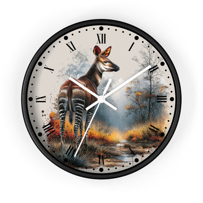 A round wall clock with a black frame and a printed nature scene featuring a zebra deer standing in a forest, with Roman numerals and white clock hands on a white background.