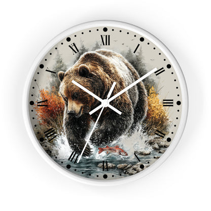 Round wall clock with a white frame and a printed design of a brown bear walking through water with autumn trees and a red salmon fish on the face, Roman numerals for hours, and white clock hands.