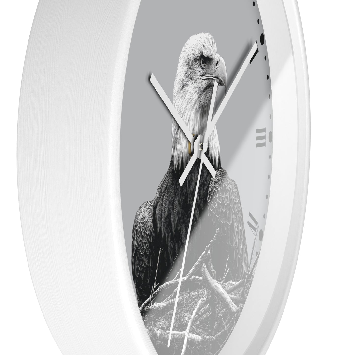 A white oval wall clock featuring a black and white photograph of a bald eagle on the clock face, with white hands and black Roman numerals.