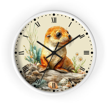 Round wall clock with a white frame and a printed illustration of a brown seal pup sitting on a log among plants and shells, with black Roman numerals and hands on a cream face.