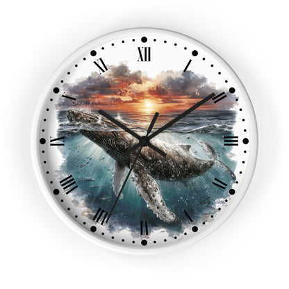 Round wall clock with a white frame and a printed ocean scene featuring a whale beneath a sunset sky, with black Roman numerals and clock hands on a white background.
