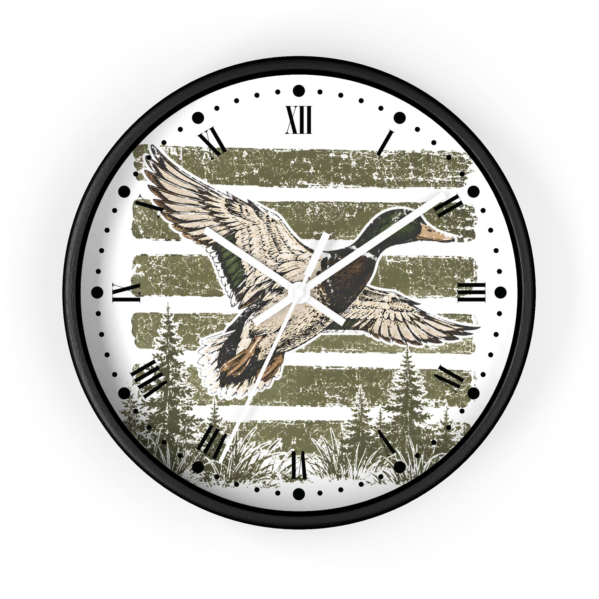 A round wall clock with a black frame and a white face featuring a flying mallard duck over distressed olive green horizontal stripes and pine trees. Roman numerals and black dot hour markers replace standard clock hands and numbers.