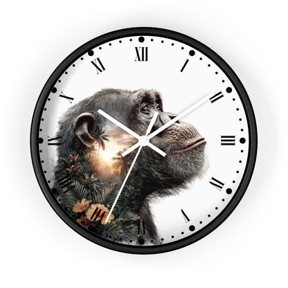 A round wall clock with a black frame, white face, Roman numerals, and a printed chimpanzee portrait with foliage and a glowing sun effect on the left side.