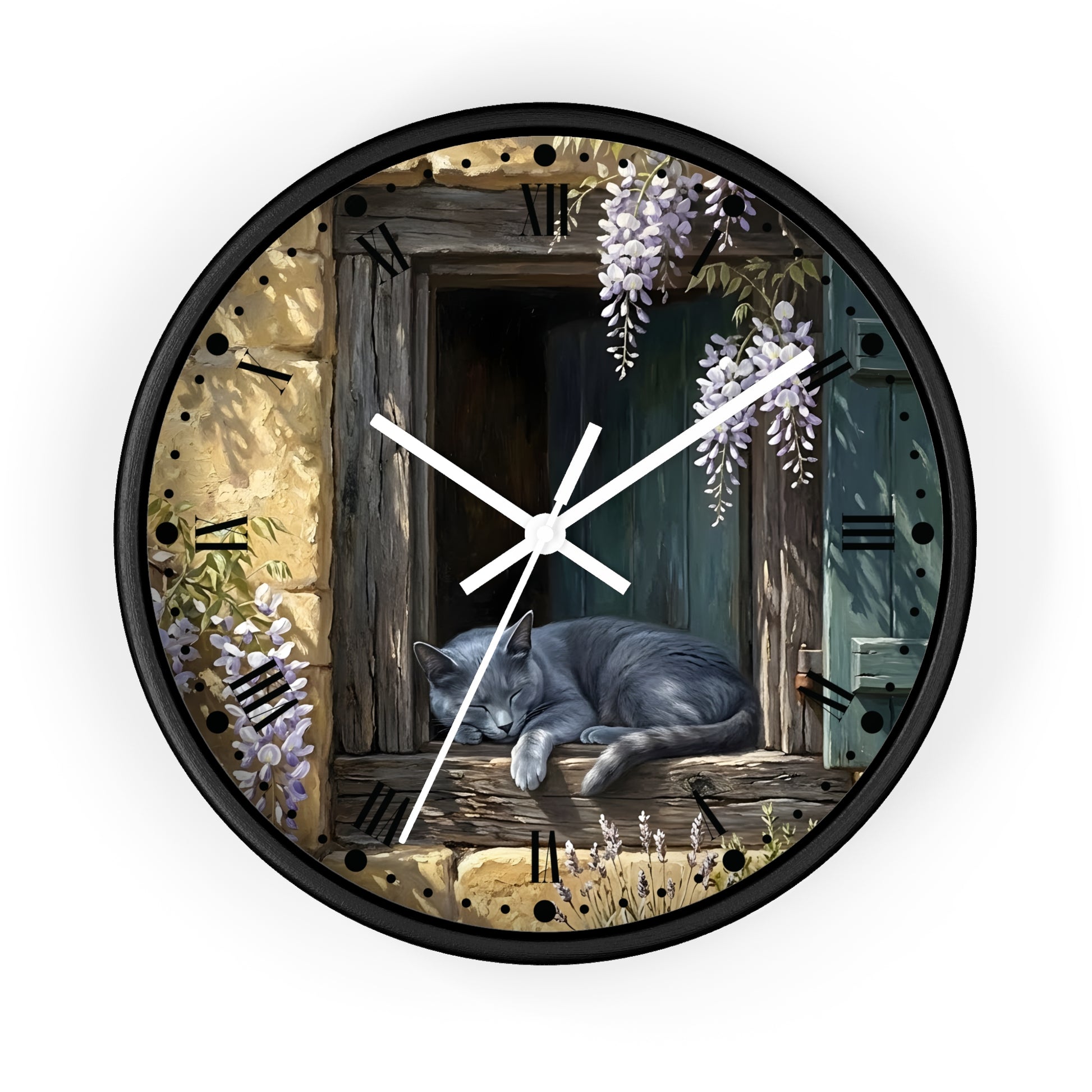 A round wall clock with a black frame and a printed illustration of a gray cat sleeping on a rustic wooden window ledge, surrounded by wisteria flowers and stone wall details. The clock is shown against a plain white background.