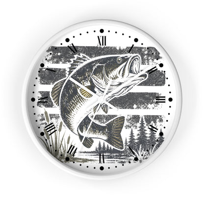 A round wall clock with a white frame and a printed design featuring a largemouth bass fish jumping over water, Roman numerals, and black clock hands on a white background.