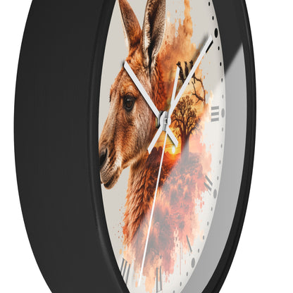 A round wall clock with a black frame and a white dial featuring a painted kangaroo portrait blended with warm orange and brown abstract brushstrokes, Roman numerals, and silver hands.