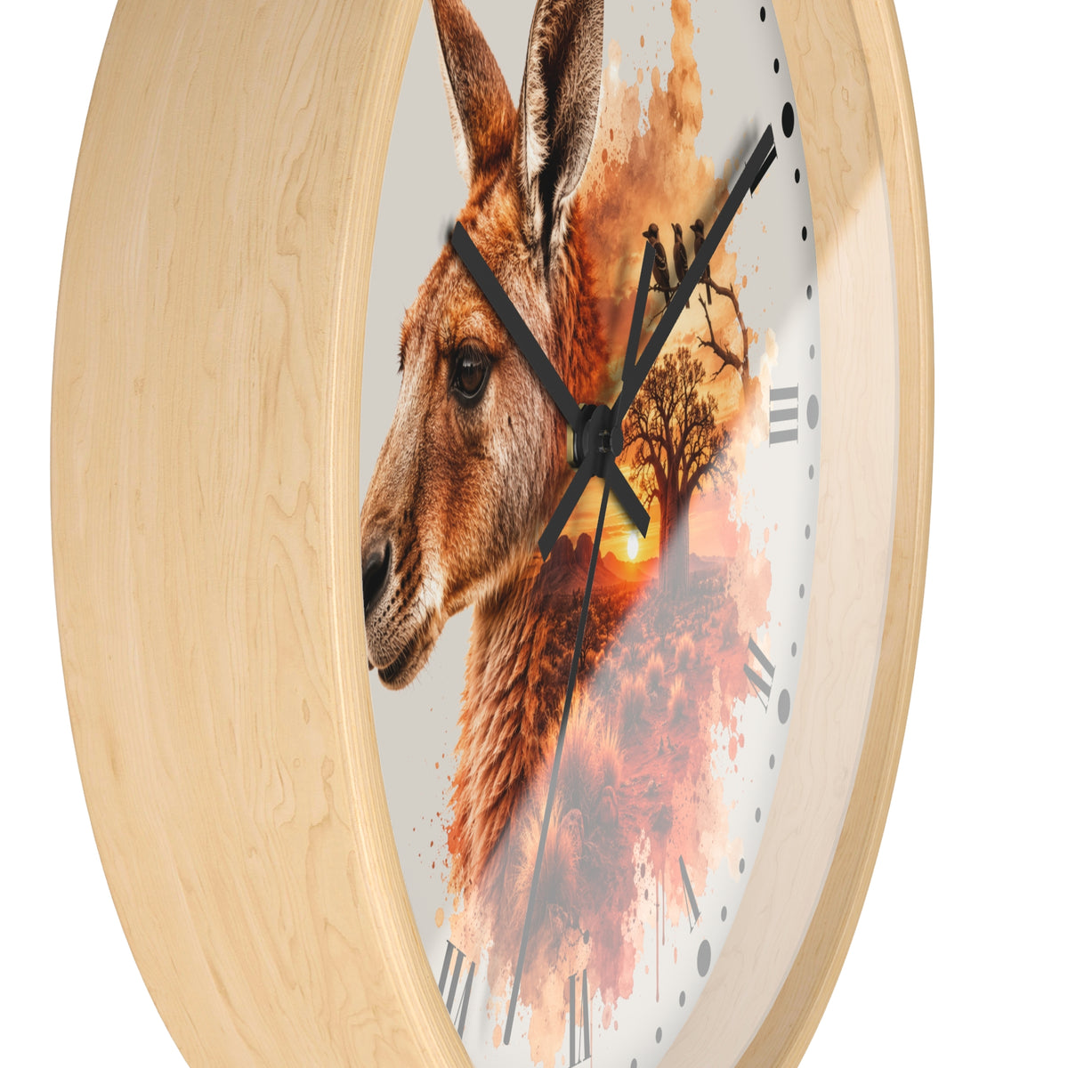 Round wall clock with a light natural wood frame and a printed face featuring a kangaroo profile over an autumn tree silhouette and sunset, with black hands and Roman numerals.