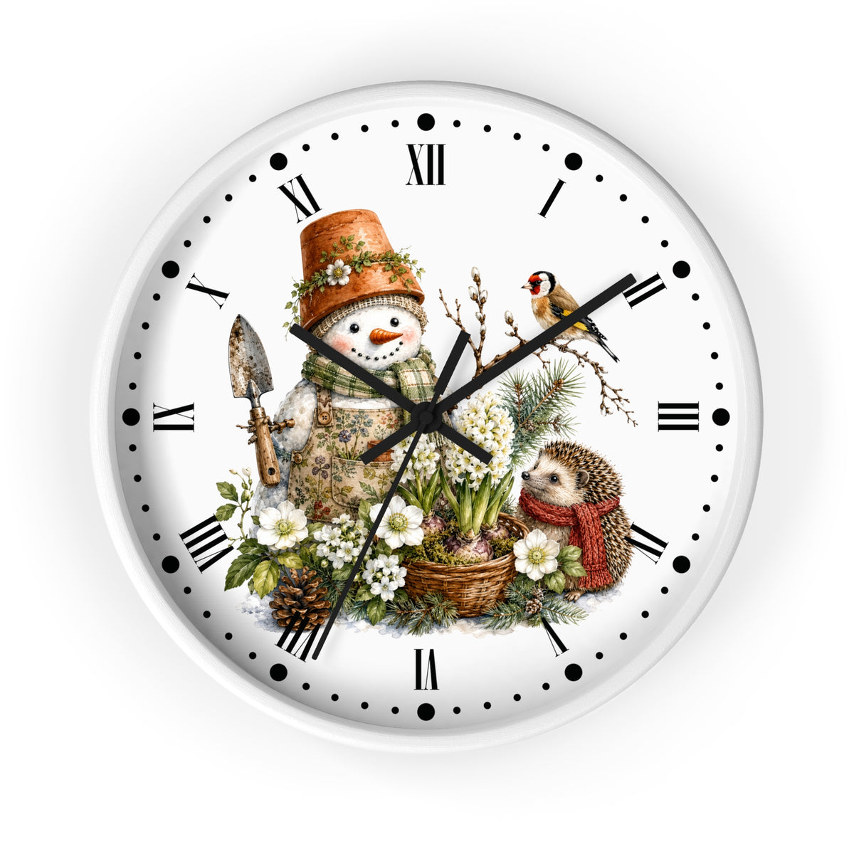 A round white wall clock with black Roman numerals and hands, featuring a whimsical winter garden illustration on the face. The design includes a snowman in a gardening hat with a trowel, a small bird, a hedgehog in a red scarf, flowers, pinecones, and greenery.
