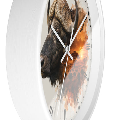 A round wall clock with a white frame and a printed face featuring a close-up water buffalo head over an orange sunset landscape, shown against a plain white background.