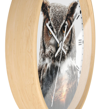 Round wall clock with a light natural wood frame and a printed owl face on the clock face, with white hands and black Roman numerals.