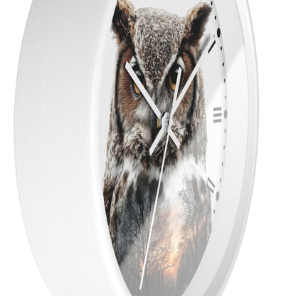 Oval wall clock with a white frame and a printed owl face on the face, with black Roman numerals and white hands, shown against a white background.