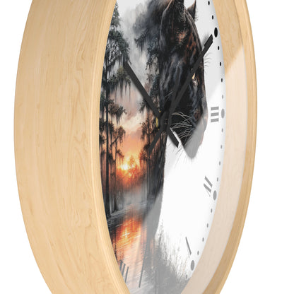 Round wall clock with a light natural wood frame and a split-face design: one half shows a black panther head, the other half shows a misty forest sunset, with black Roman numerals and black hands on a white background.