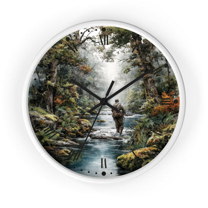 A round wall clock with a white frame and black hands, featuring a scenic forest illustration of a person walking along a stream. Roman numerals mark the hours, and the clock is centered on a plain white background.