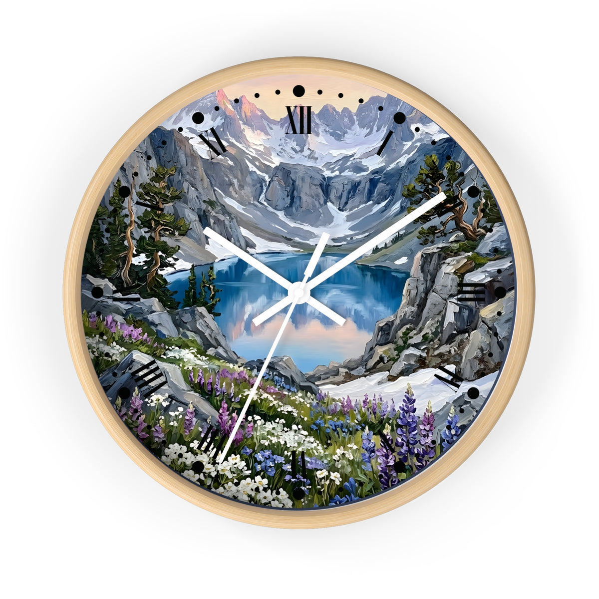 A round wall clock with a light natural wood frame and a scenic mountain landscape printed on the face. The artwork shows snow-capped peaks, a blue lake, rocky cliffs, evergreen trees, and wildflowers, with black Roman numeral hour markers and white clock hands.