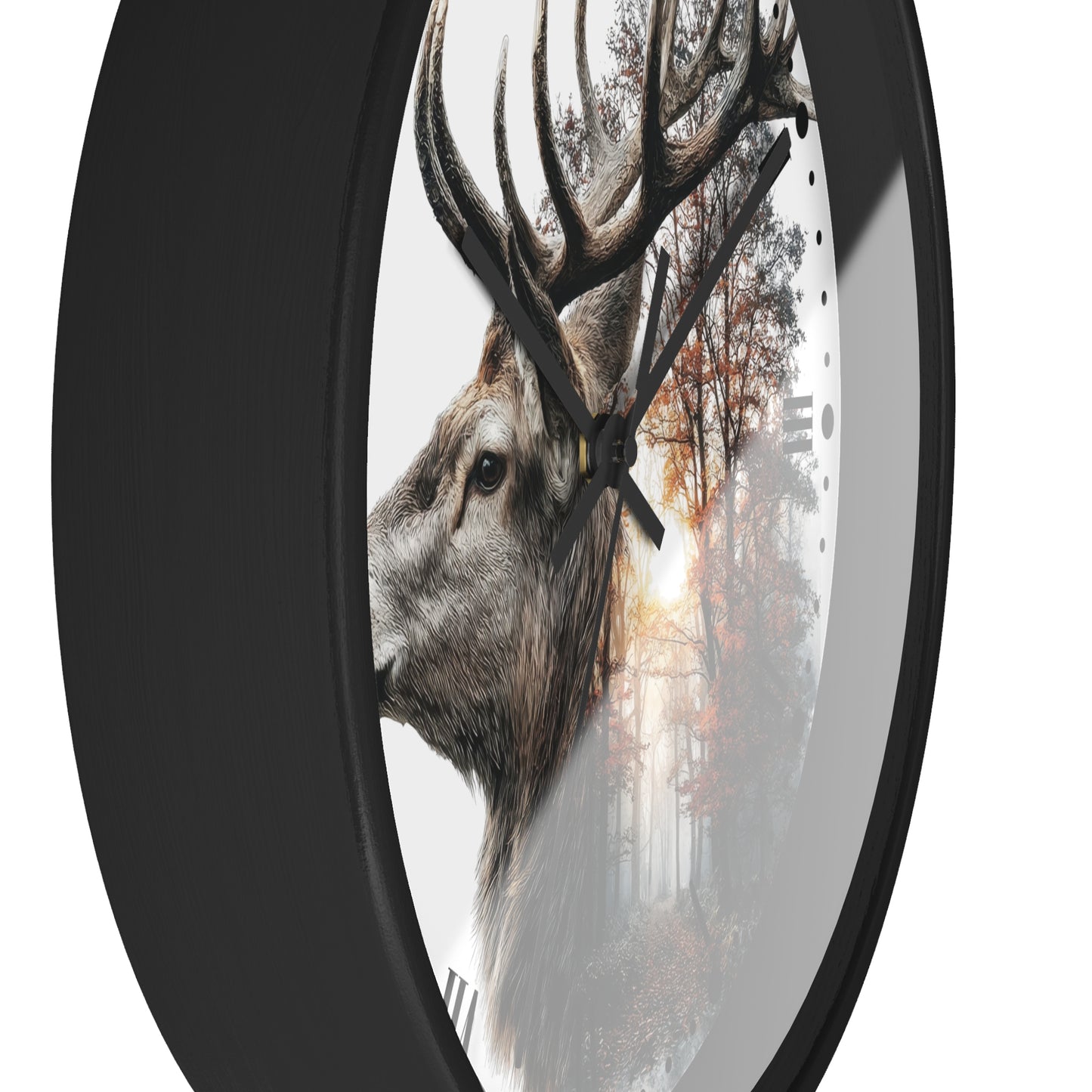 A round wall clock with a black frame and a printed design of a deer head layered over a misty forest scene, shown against a plain white background.