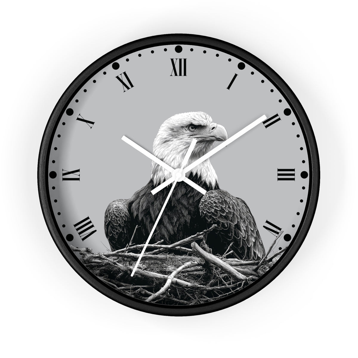 Round wall clock with a black frame and a grayscale bald eagle perched in a nest on the clock face, with Roman numerals and white hands, shown against a light gray background.