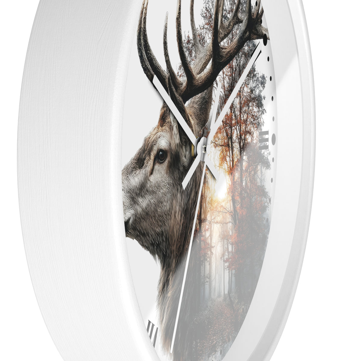 A round wall clock with a white frame and a printed design featuring a deer head in profile over a misty forest scene at sunrise.