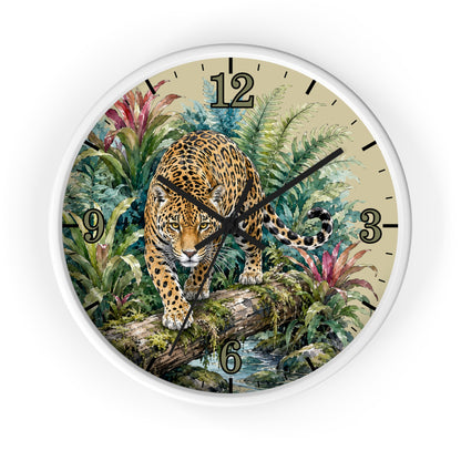 A round wall clock with a white frame and a detailed illustration of a leopard walking over a log in a lush jungle scene. The clock face has a beige background with black Arabic numerals and black clock hands.