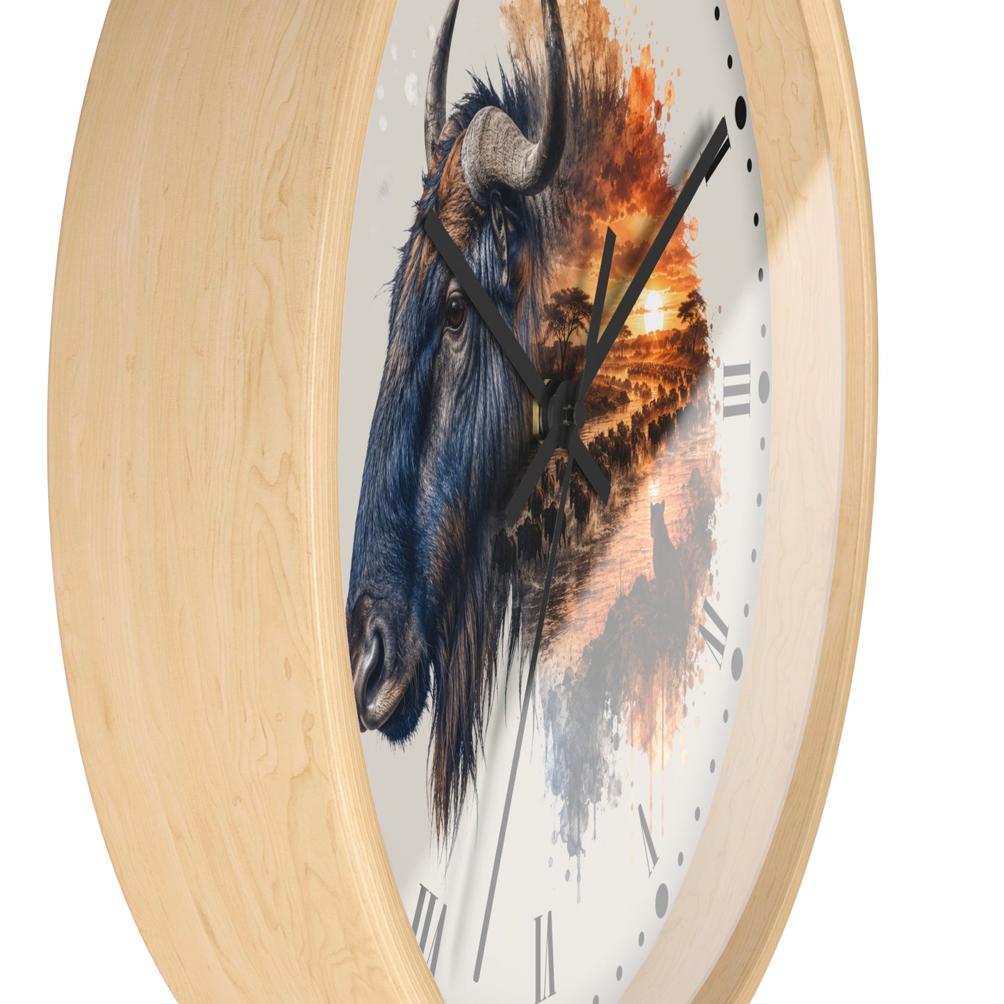 Round wall clock with a light natural wood frame and a white face featuring a painted blue-gray bison head blending into an orange sunset landscape. Black clock hands and Roman numerals are visible against a plain white background.