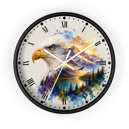 A round wall clock with a black frame and Roman numeral hour markers, featuring a watercolor-style design of a bald eagle over a mountain lake landscape on a light beige face.