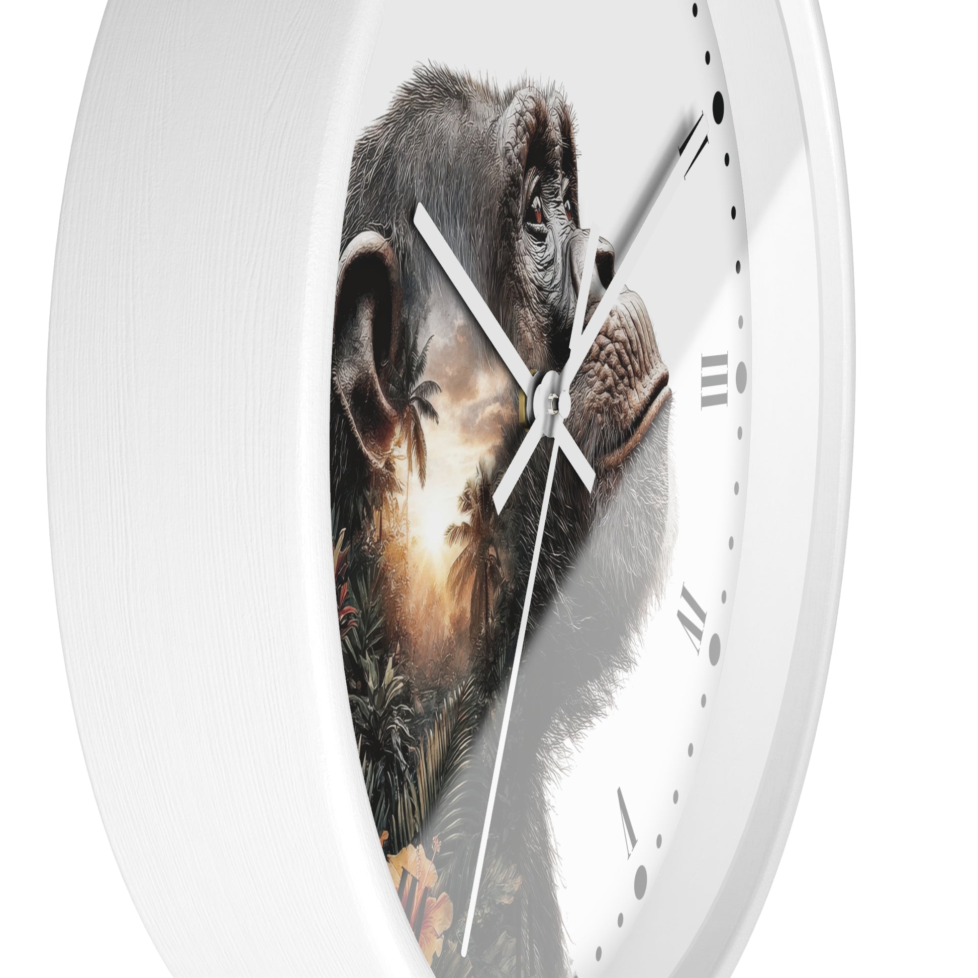 A white round wall clock with a printed chimpanzee face across the dial and silver hands, shown against a plain white background.