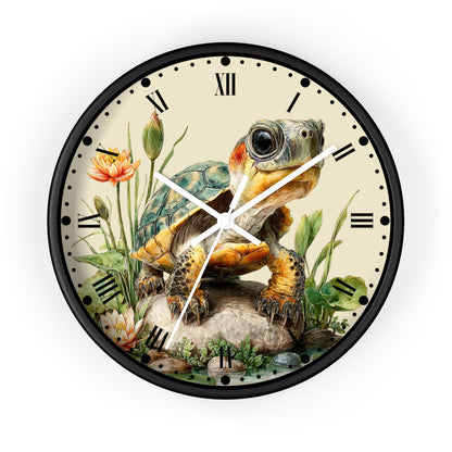Round wall clock with a black frame and a vintage-style illustration of a turtle on the face, surrounded by flowers and plants, with Roman numerals as hour markers.