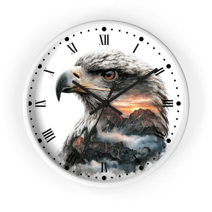 Round wall clock with a white frame and face, featuring a detailed eagle head illustration over a mountain sunset scene, with black Roman numerals and hands on a white background.