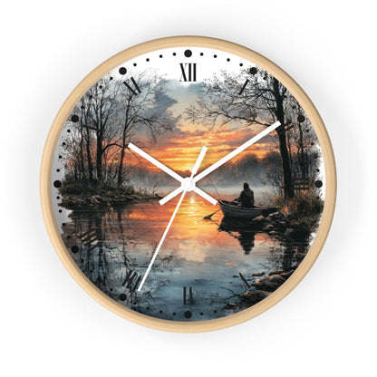 A round wall clock with a light wood frame and a scenic print of a sunset over a lake, featuring a silhouetted figure in a boat and Roman numeral hour markers.