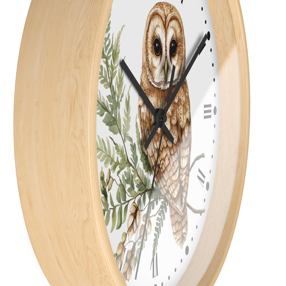 Round wall clock with a light natural wood frame and a white dial featuring a detailed illustration of a barn owl perched among green leaves and branches.