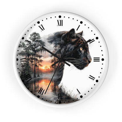 A round wall clock with a white frame and Roman numerals, featuring a printed design of a black panther's head over a misty forest and sunset scene.