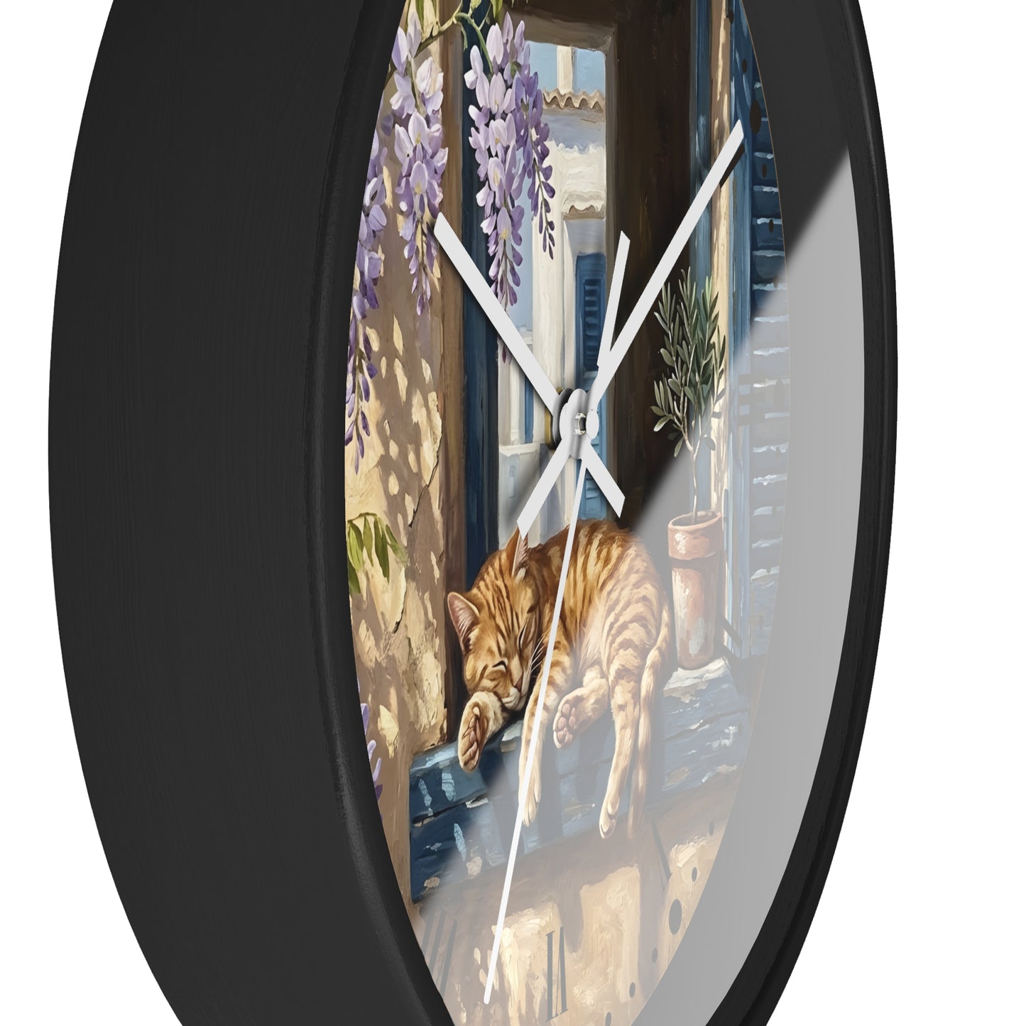 Round wall clock with a black frame and a printed illustration of an orange tabby cat sleeping on a windowsill, with purple wisteria and a sunlit balcony scene.