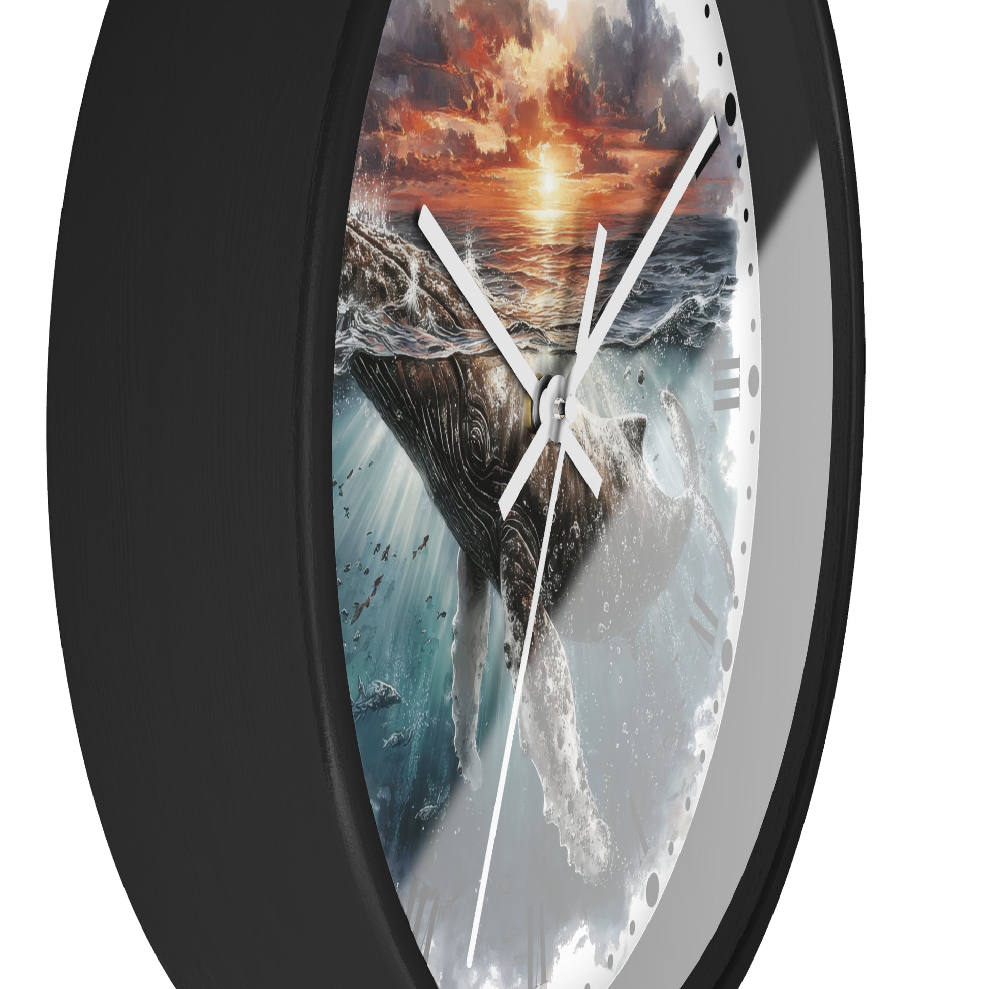 A round wall clock with a black frame and a printed ocean scene featuring a whale, waves, and a dramatic sunset sky. White clock hands are visible against a plain white background.