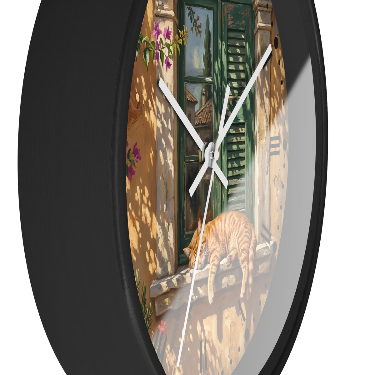 Round wall clock with a black frame and a printed scene of a sunlit courtyard with green shutters, flowers, and a sleeping orange cat. The clock is shown against a plain white background.
